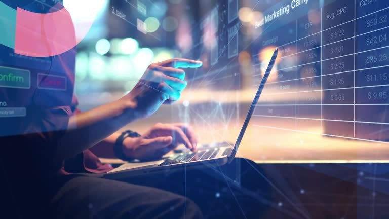 Man Using a Laptop with Business data Analytics dashboard animated overlays